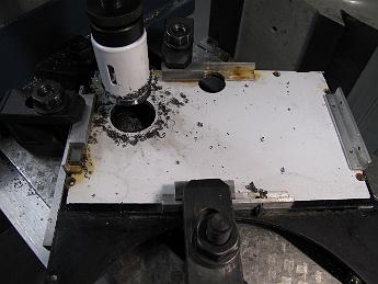  Modifications to the Crab: cutting a hole in the cab floor for the water tank 1/4 NPT drain valve with a hole saw.
